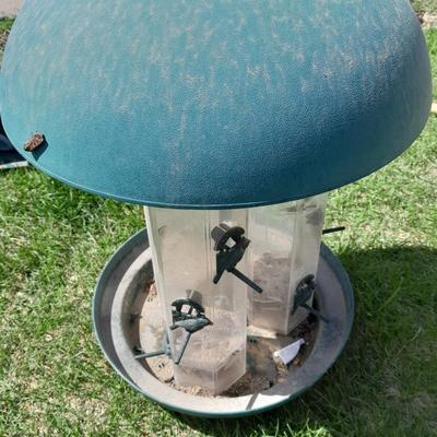 Large plastic bird feeder with bird feeder scoop