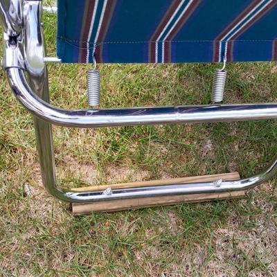 Two metal framed folding chairs