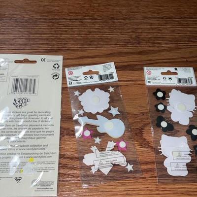 lot of 3 superwomen and hello kitty