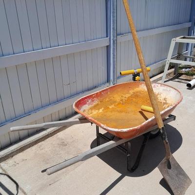 Wheelbarrow and shovel