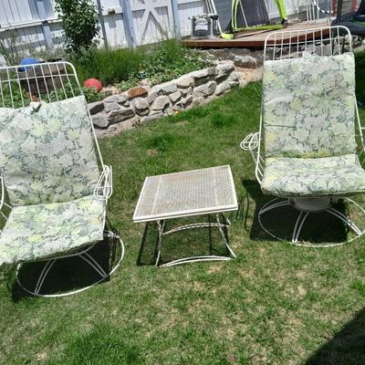 Two Vintage Metal High back Homecrest Swivel chairs with cushions and a small table
