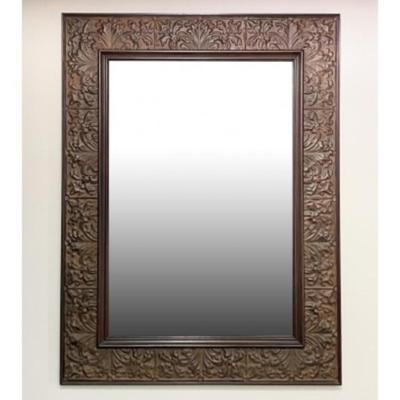 A Large, Embossed Tin Framed Mirror