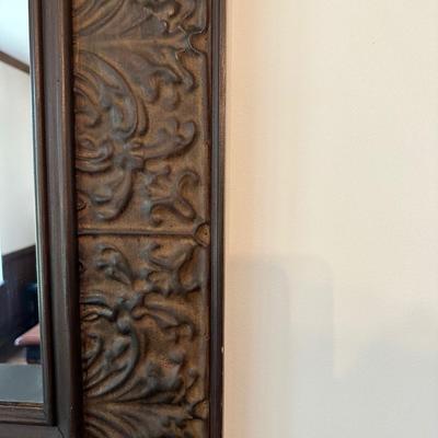 A Large, Embossed Tin Framed Mirror