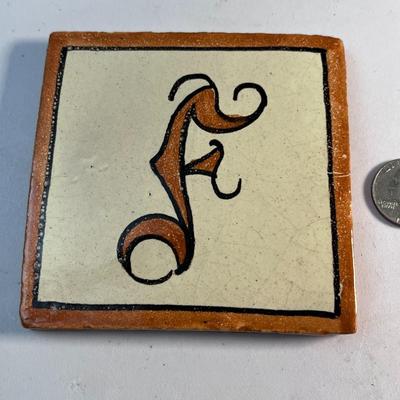 TERRA COTTA FANCY â€œFâ€ TILE 4â€ SQUARE