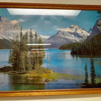 large mountain lake framed artwork and smaller waterfall picture