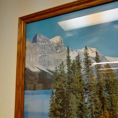 large mountain lake framed artwork and smaller waterfall picture