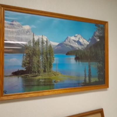 large mountain lake framed artwork and smaller waterfall picture