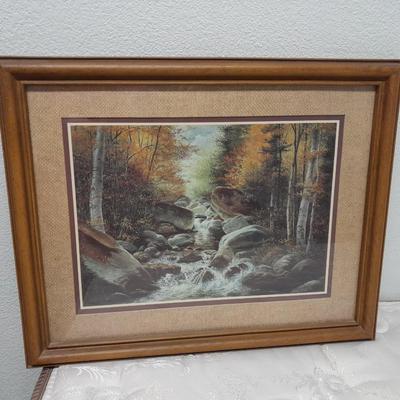 large mountain lake framed artwork and smaller waterfall picture