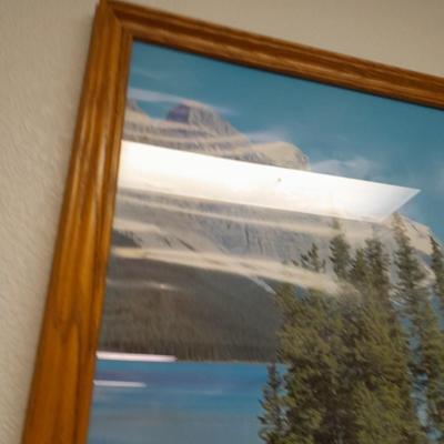 large mountain lake framed artwork and smaller waterfall picture
