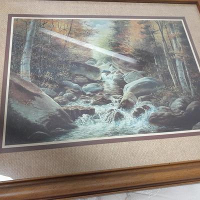 large mountain lake framed artwork and smaller waterfall picture