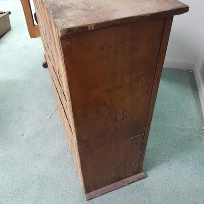 Antique Storage Accessory Cabinet Fixed Shelves with white wooden chair