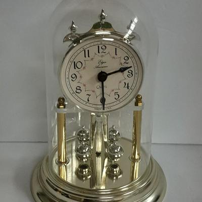 Elgin American Quartz Anniversary clock with globe, and MCM wall hangings