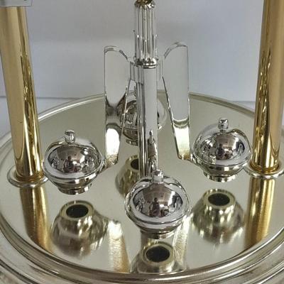 Elgin American Quartz Anniversary clock with globe, and MCM wall hangings