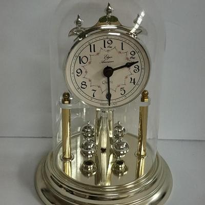 Elgin American Quartz Anniversary clock with globe, and MCM wall hangings