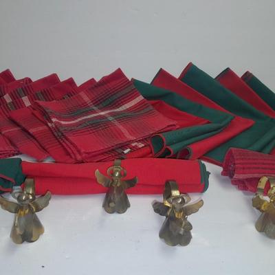 Brass angel napkin rings, with red and green linen napkins