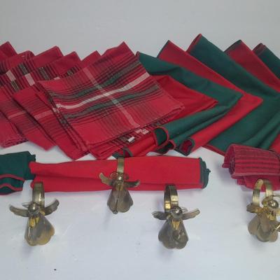 Brass angel napkin rings, with red and green linen napkins