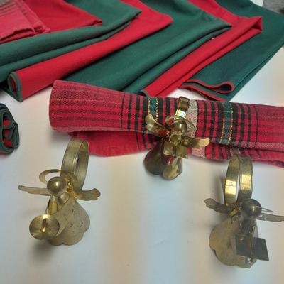 Brass angel napkin rings, with red and green linen napkins