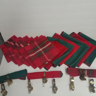 Brass angel napkin rings, with red and green linen napkins
