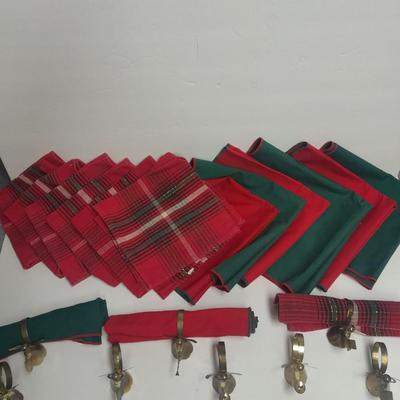 Brass angel napkin rings, with red and green linen napkins