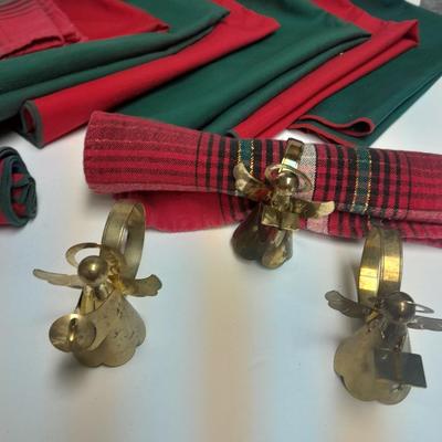 Brass angel napkin rings, with red and green linen napkins