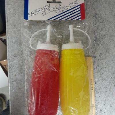 Large stainless steel cooking utensils Barbeque grill or firepit and condiment containers