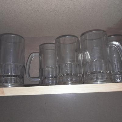 Etched ship drinking glasses with plastic handled drinking mugs.