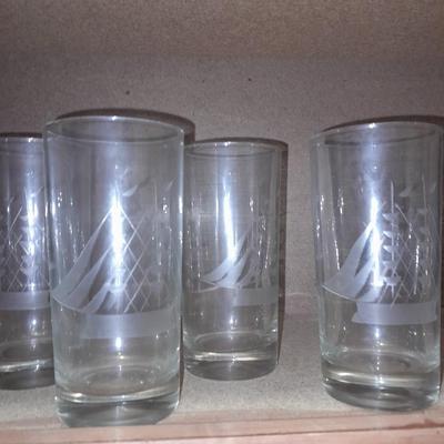 Etched ship drinking glasses with plastic handled drinking mugs.