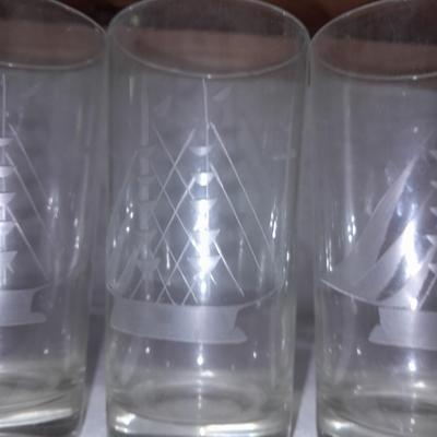 Etched ship drinking glasses with plastic handled drinking mugs.