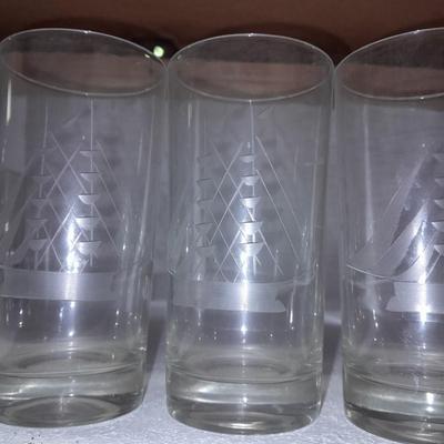 Etched ship drinking glasses with plastic handled drinking mugs.