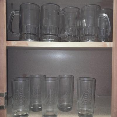 Etched ship drinking glasses with plastic handled drinking mugs.