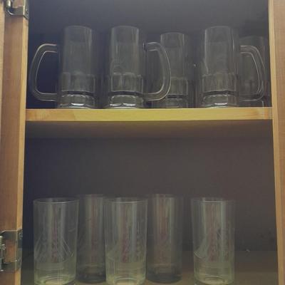 Etched ship drinking glasses with plastic handled drinking mugs.