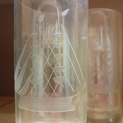 Etched ship drinking glasses with plastic handled drinking mugs.