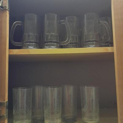 Etched ship drinking glasses with plastic handled drinking mugs.