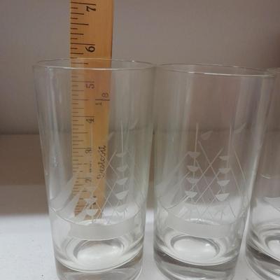 Etched ship drinking glasses with plastic handled drinking mugs.