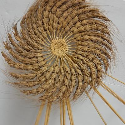 Woven wheat grass windmill, with Hardware made Horsehoe Roping cowboy.