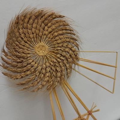 Woven wheat grass windmill, with Hardware made Horsehoe Roping cowboy.