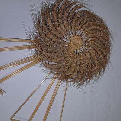 Woven wheat grass windmill, with Hardware made Horsehoe Roping cowboy.