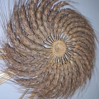 Woven wheat grass windmill, with Hardware made Horsehoe Roping cowboy.