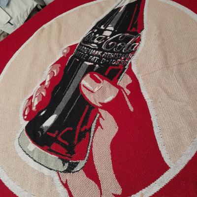 2 blankets, coco-cola and bible verse.