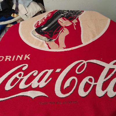 2 blankets, coco-cola and bible verse.