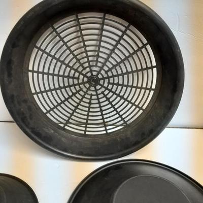 two gold pans and one strainer and a rock pic