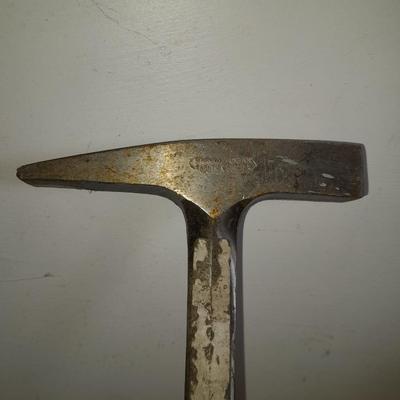 two gold pans and one strainer and a rock pic