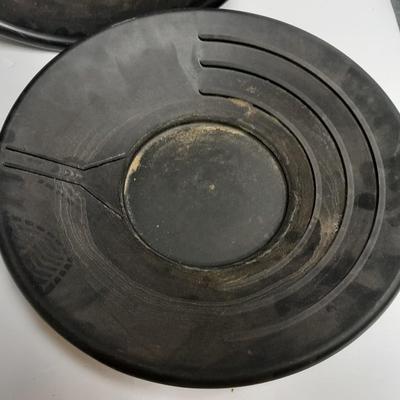 two gold pans and one strainer and a rock pic