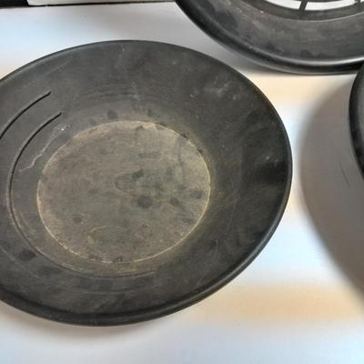 two gold pans and one strainer and a rock pic