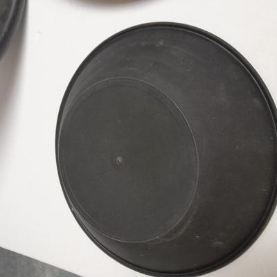 two gold pans and one strainer and a rock pic