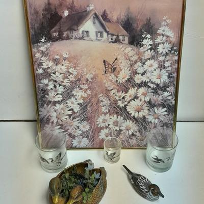 Country famed art work and duck decor.