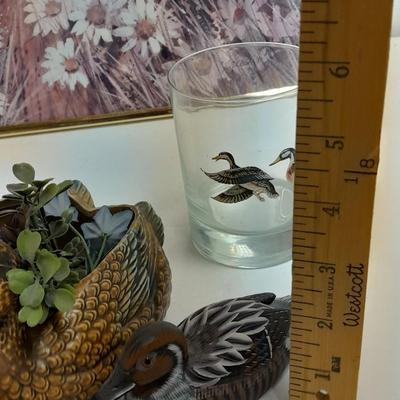 Country famed art work and duck decor.