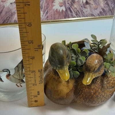 Country famed art work and duck decor.