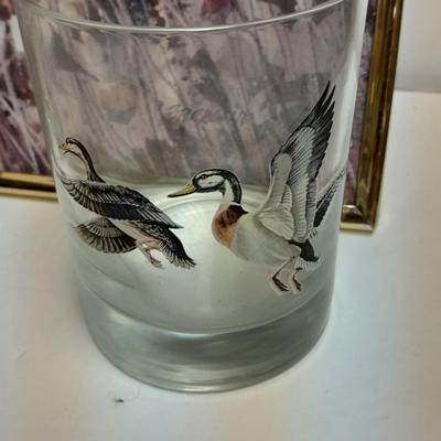 Country famed art work and duck decor.