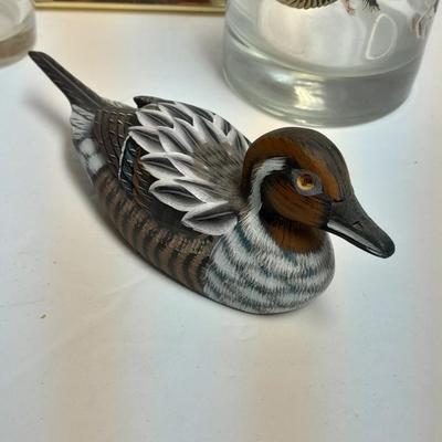 Country famed art work and duck decor.